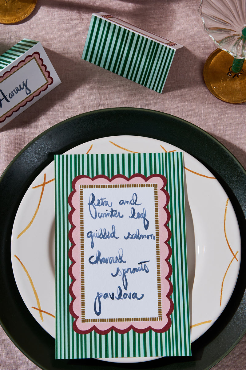 Flatlay candy stripe menu dinner party